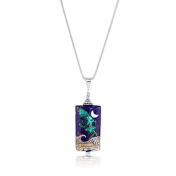 Blue art glass pendant with a moon and stars on a sterling silver chain